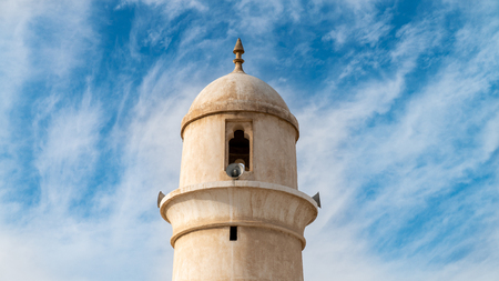 Doha, Qatar - February 2019: Minaret of Souq Waqif mosque, located in historical market area and surrounded by shopping quarters with stores, cafes and hotelsのeditorial素材