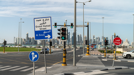 Doha, Qatar - February 2019: Car traffic on the corniche road and city center streetsのeditorial素材