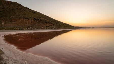 Sunset over the coast of Maharloo pink lake in Shiraz, Iranの写真素材