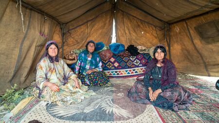 Shiraz, Iran - May 2019: Qashqai nomadic women inside their tents. The Qasqhai are nomadic people living in temporary villages.のeditorial素材
