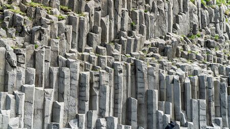 Basalt columns geological formation at Reynisfjara beach, southern coast of Icelandの写真素材