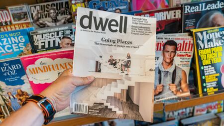 San Francisco, USA - August 2019: Hand holding a copy of Dwell Magazineのeditorial素材