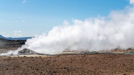Hverir Myvatn geothermal area with boiling mudpools and steaming fumaroles in Icelandの写真素材