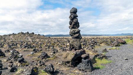 Cairns made of stones on a lava field called Laufskalavarda in southern Icelandの写真素材
