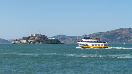San Francisco, California, USA - August 2019: Tourist boat traveling towards Alcatrazのeditorial素材