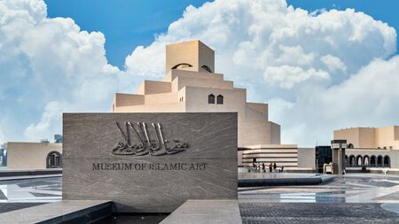 Doha, Qatar - February 2019: Museum of Islamic Art signage at the entrance. The building was designed by architect I. M. Pei is located on the Doha Corniche.のeditorial素材