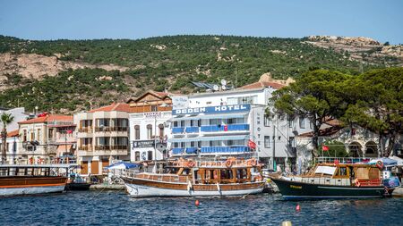 Foca, Izmir, Turkey - August 2013: Boats along the coastline of resort town of Focaのeditorial素材