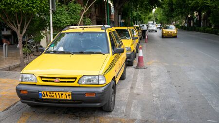 Isfahan, Iran - May 2019: Yellow taxi car on the streetのeditorial素材