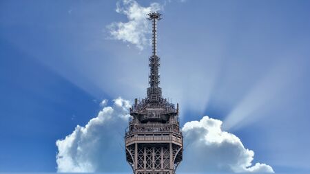 Paris, France - September 2016: Closeup of top of Eiffel Tower in Paris shot against a blue skyのeditorial素材