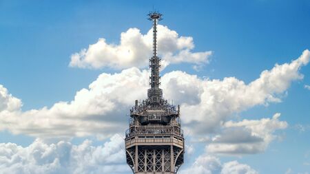 Paris, France - September 2016: Closeup of top of Eiffel Tower in Paris shot against a blue skyのeditorial素材