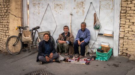 Isfahan, Iran - May 2019: Iranian men selling various items on the pavement in Grand Bazaar of Isfahanのeditorial素材