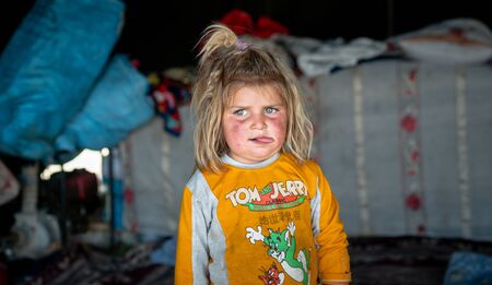 Shiraz, Iran - May 2019: Qashqai Turkish nomadic child inside a tent. The Qasqhai are nomadic people living in temporary villages.のeditorial素材