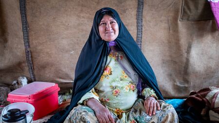 Shiraz, Iran - May 2019: Qashqai nomadic woman inside her tent. The Qasqhai are nomadic people living in temporary villages.のeditorial素材