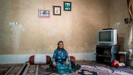 Shiraz, Iran - May 2019: Qashqai Turkish woman wearing a traditional dress in her houseのeditorial素材
