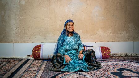 Shiraz, Iran - May 2019: Qashqai Turkish woman wearing a traditional dress in her houseのeditorial素材