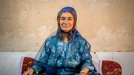 Shiraz, Iran - May 2019: Qashqai Turkish woman wearing a traditional dress in her houseのeditorial素材