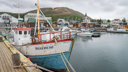 Husavik, Iceland - August 2019: Traditional old wooden fisherman boats used for whale watching in Husavik harborのeditorial素材