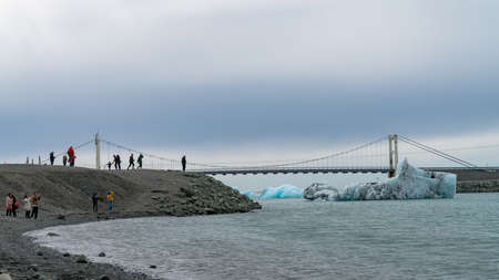 View of icebergs in Jokulsarlon glacier lagoon formed with melting ice, Iceland, global warming and climate change conceptのeditorial素材