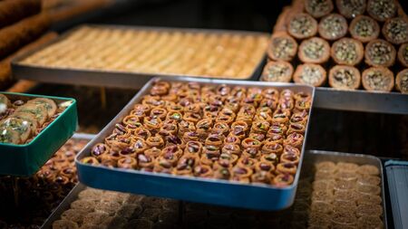 Assortment of delicious Turkish traditional dessert baklava from Turkish cuisine. Photo shot with depth of field and blurry on purposeの写真素材