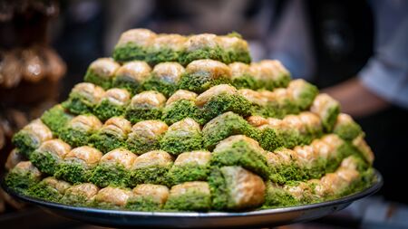 Assortment of delicious Turkish traditional dessert baklava from Turkish cuisine. Photo shot with depth of field and blurry on purposeの写真素材