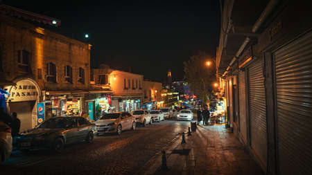 Mardin, Turkey - January 2020: Old city Mardin at night with local shops and touristsのeditorial素材