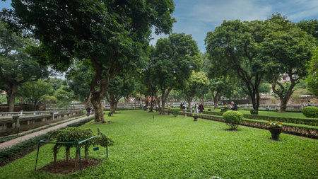 Hanoi, Vietnam - November 2015: Visitors at Garden of Temple of Literature, the first university school in Ha Noi, Vietnam as Vietnam National Heritageのeditorial素材