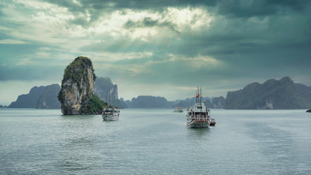 Ha Long Bay, Vietnam - December 2015: Tourist boat sailing in Ha Long Bay at the Gulf of Tonkin of the South China Sea. The Halong Bay is a popular tourist destination of Asiaのeditorial素材