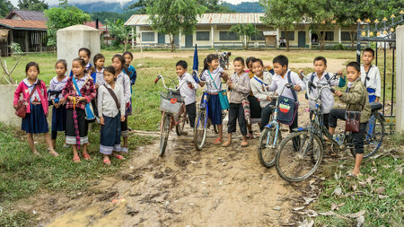 Laos - December 2015: School kids at the entrance of their primary school, Laos countrysideのeditorial素材