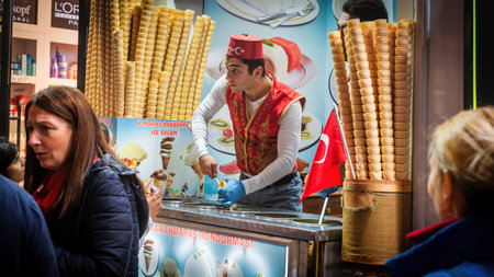 Istanbul, Turkey - November 2019: Famous Turkish ice cream seller selling on a street
