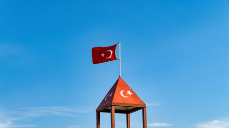 Turkish flag waving at blue sky. Turkey country flag flowing in the wind at blue sky.