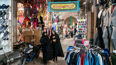 Isfahan, Iran - May 2019: iranian ancient isfahan grand bazaar, market full of carpet or souvenir shops. A popular landmark in Isfahan with tourists and local people shopping.のeditorial素材