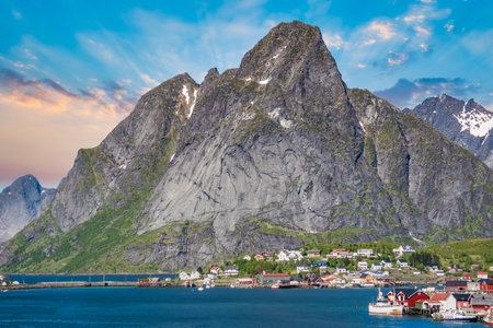 Reine, Lofoten, Norway - June 2016: The village of Reine under a sunny, blue sky, with the typical rorbu housesのeditorial素材