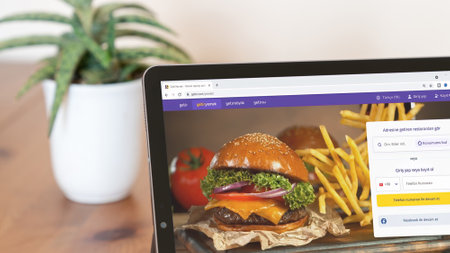 Istanbul, Turkey - August 2021: Illustrative Editorial of Turkish Getir website homepage. Getir logo visible on a tablet screen. Getir is an on-demand ultrafast delivery service for grocery items.のeditorial素材
