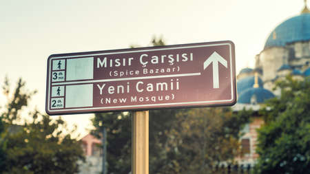 Touristic districts of Istanbul on a road sign. Spice Bazaar or Misir Carsisi in Turkish, also New Mosque or Yeni Camii in Turkish. Historical centers of Istanbul, Turkeyの写真素材