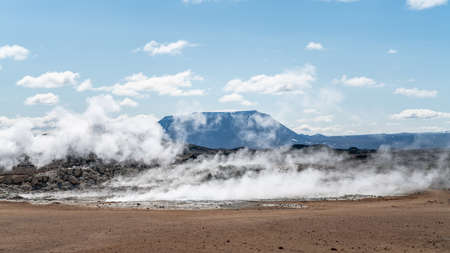 Hverir Myvatn geothermal area with natural steam vents and mud pools all around Lake Myvatn, the...