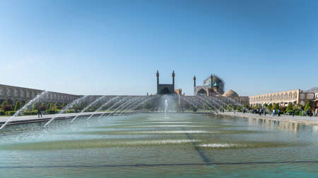 Isfahan, Iran - May 2019: Naqsh-e Jahan Square with a big pond and many fountainsのeditorial素材
