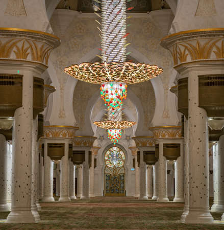 Abu Dhabi, United Arab Emirates - February 2022: Golden Chandelier inside Sheikh Zayed Grand Mosque....