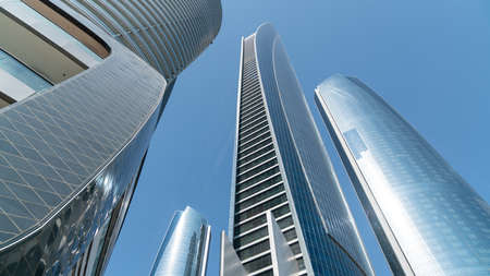 Abu Dhabi, United Arab Emirates - February 2022: Etihad Towers are five skyscrapers complex with 74 floors is the third tallest building in Abu Dhabi.のeditorial素材