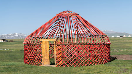 Traditional Yurt tent under construction in Kyrgyzstan. Yurt tents are traditional, portable tents made of felt that are used as a form of accommodation in the country.の写真素材
