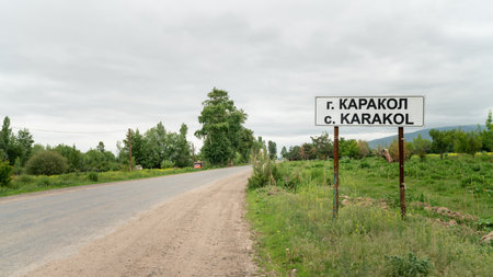 The city border sign of Karakol city, Kyrgyzstan welcomes visitors to the charming city known for its natural beauty and cultural heritage in the heart of Central Asia.の写真素材