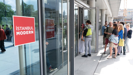 Istanbul, Turkey - April 2017: People lined up to enter Istanbul Modern, a modern art museum by the...