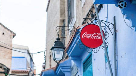 Chefchaouen, Morocco - 11 September 2022: Red Coca Cola sign at Chefchaouen known as the blue city Morocco at a local store, Moroccoのeditorial素材