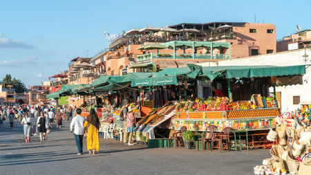 Marrakesh, Morocco - 15 September 2022: Fruit vendors selling fruit juice in famous Jemaa el Fnaa market square in the old city of Marrakeshのeditorial素材