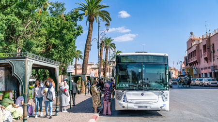 Marrakech, Morocco - 15 September 2022: Local Moroccan people getting on the public transportation bus in city center downtownのeditorial素材