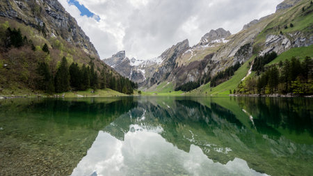 Seealpsee lake with the Swiss Alps in the background, Appenzeller Land, Switzerlandの写真素材