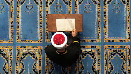 Savsat, Artvin, Turkey - 31 November 2021: Imam reading Quran, holy book of Islam during Ramadan in...