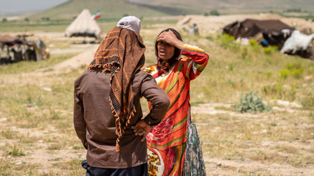 Shiraz, Iran - 5 May 2019: Qashqai Turkish man and woman talking. Qashqai are nomadic people living...