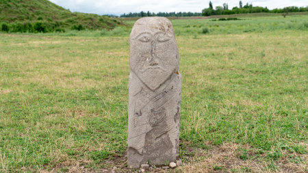 Stone sculptures near the Old Burana Tower in Kyrgyzstan, depicting historical figures, reflecting the country's rich cultural heritage.の写真素材
