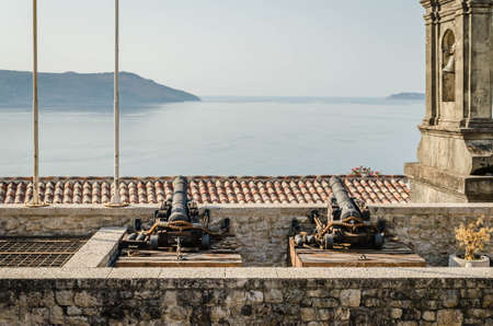 Old cast cannons on the walls of the old town in Herceg Novi.の写真素材