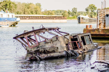 Stranded Old abandoned tanker wreck on the banksof the Danube River in Novi Sad.